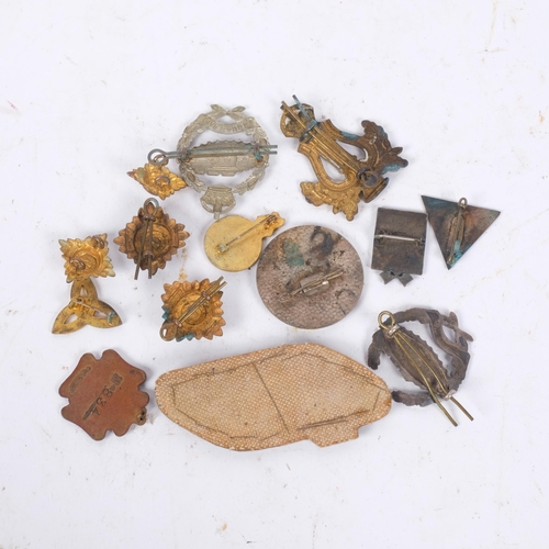 307 - Various military cap badges and pin brooches, including Tank Regiment cloth badge