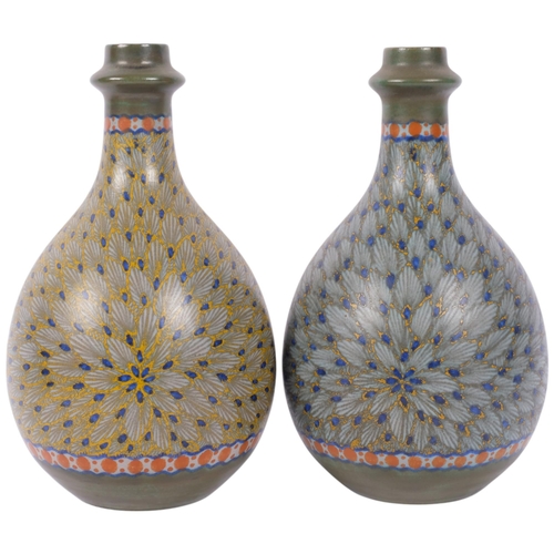 314 - A pair of Dutch Gouda pottery bottle vases, Panka signed on base, 20.5cm