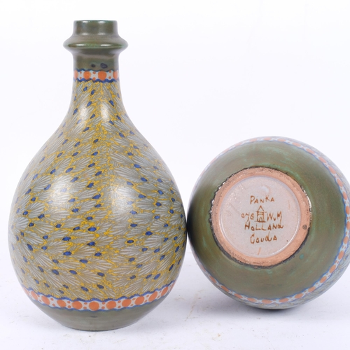 314 - A pair of Dutch Gouda pottery bottle vases, Panka signed on base, 20.5cm