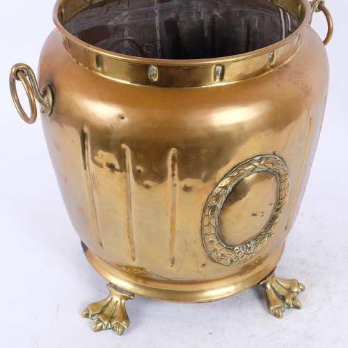 39 - Victorian circular brass coal bin, on eagle claw feet, H34cm