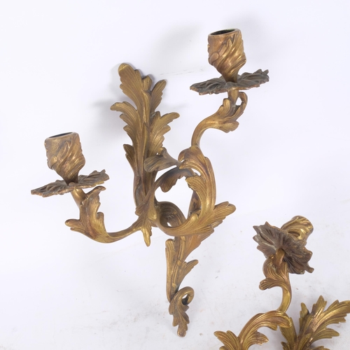 47 - A pair of Rococo style gilt-brass twin-branch wall sconces, H30cm