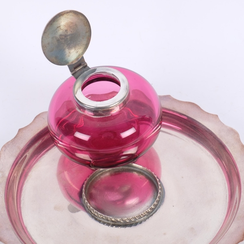 550 - An Antique silver plated cranberry glass desk inkstand, base diameter 18cm