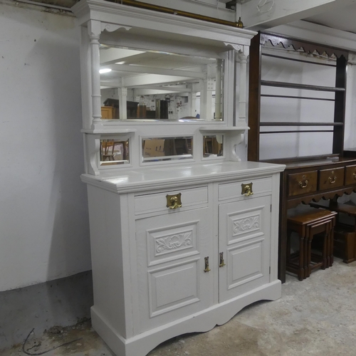 2321 - A Victorian painted mahogany two-section dresser, with raised mirror back, two drawers and cupboards... 