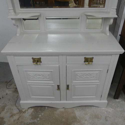 2321 - A Victorian painted mahogany two-section dresser, with raised mirror back, two drawers and cupboards... 