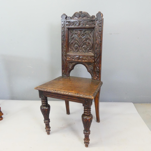 2359 - A Victorian Arts & Crafts carved oak hall chair.