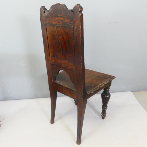 2359 - A Victorian Arts & Crafts carved oak hall chair.