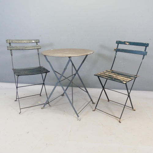 2432 - A pair of French Parisienne folding bistro chairs, and a metal circular topped folding table, diamet... 