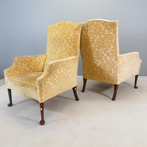 2479 - An pair of antique Georgian style mahogany and upholstered fireside armchairs.