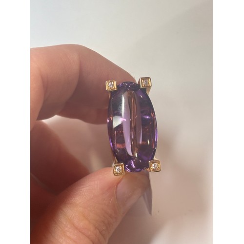 1141 - VAN CLEEF & ARPELS - an 18ct gold amethyst and diamond ring, geometric design set with a 25ct oval d... 