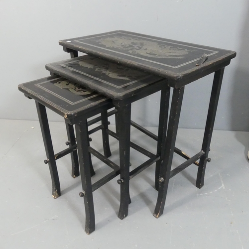 2507 - A Chinese black lacquered nest of three rectangular occasional tables, with carved and painted drago... 