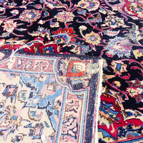 2508 - A large antique blue and red-ground Tabriz carpet. Length 385cm, width 300cm.