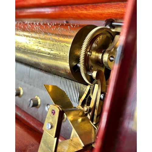 53 - A Swiss 19th century musical box, rosewood and marquetry inlaid case, playing 4 airs on a 21cm cylin... 