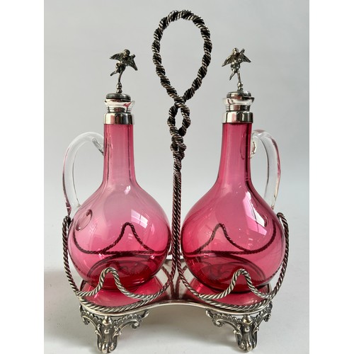 10 - A Victorian silver plated cranberry glass 2-decanter set on stand, by Roberts & Belk, stand height 2... 