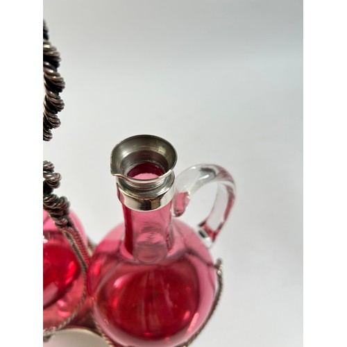 10 - A Victorian silver plated cranberry glass 2-decanter set on stand, by Roberts & Belk, stand height 2... 