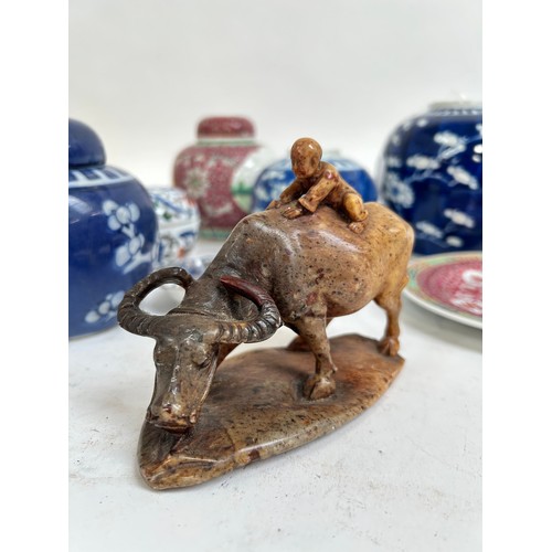 125 - A Chinese blue and white porcelain prunus pattern ginger jars, a soapstone water buffalo, 13cm, etc