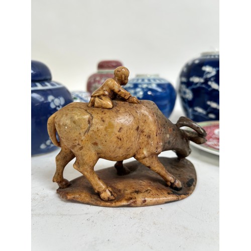 125 - A Chinese blue and white porcelain prunus pattern ginger jars, a soapstone water buffalo, 13cm, etc