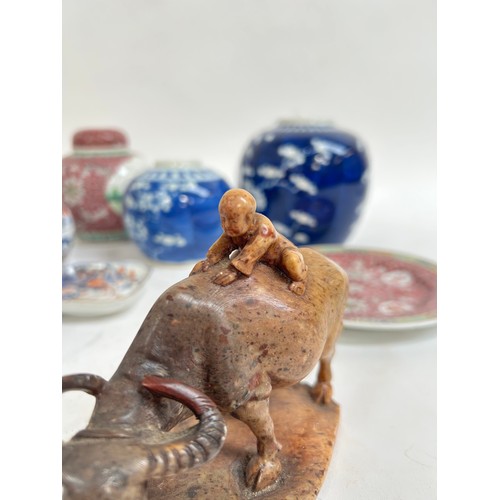 125 - A Chinese blue and white porcelain prunus pattern ginger jars, a soapstone water buffalo, 13cm, etc