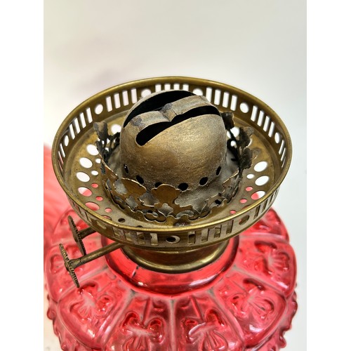 20 - A Victorian Duplex brass cranberry glass oil lamp, with original moulded cranberry glass shamrock fo... 