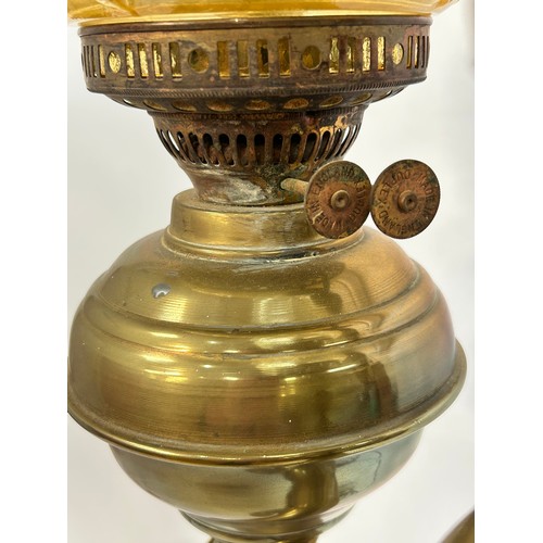 8 - A Victorian brass double oil lamp, with original moulded uranium glass shades and funnels, converted... 