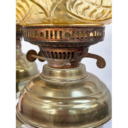 8 - A Victorian brass double oil lamp, with original moulded uranium glass shades and funnels, converted... 