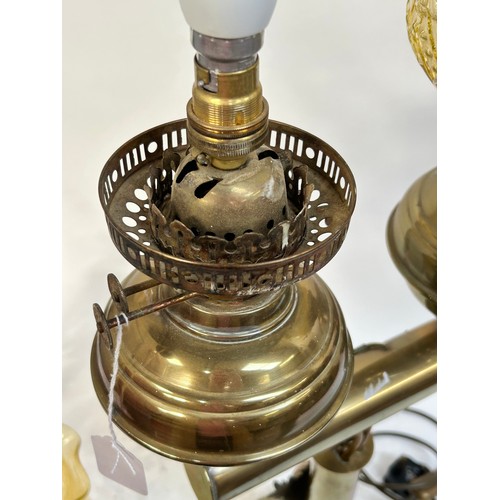 8 - A Victorian brass double oil lamp, with original moulded uranium glass shades and funnels, converted... 