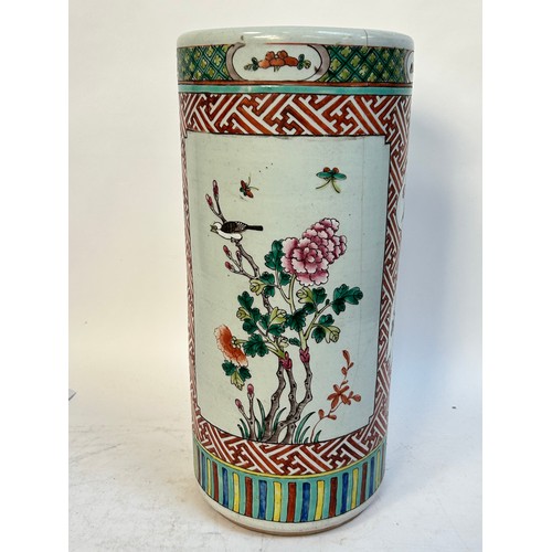 135 - A Chinese famille vert ceramic barrel stick stand, 45cm