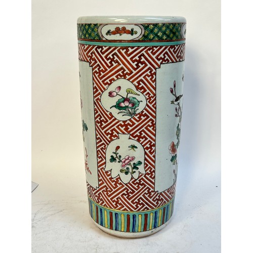 135 - A Chinese famille vert ceramic barrel stick stand, 45cm