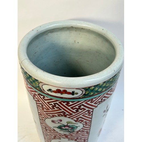 135 - A Chinese famille vert ceramic barrel stick stand, 45cm