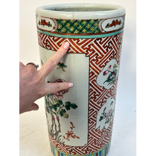 135 - A Chinese famille vert ceramic barrel stick stand, 45cm