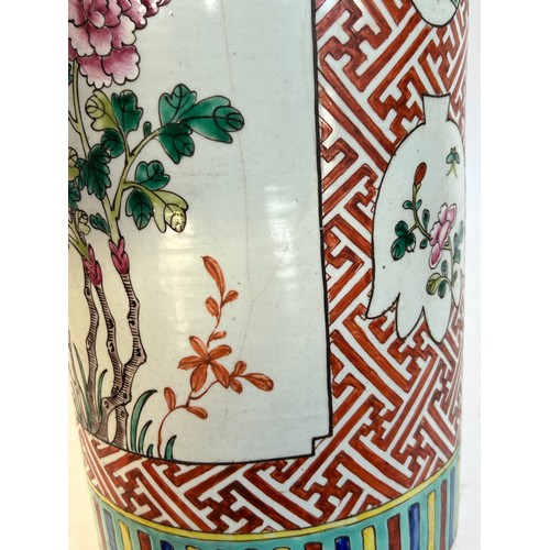 135 - A Chinese famille vert ceramic barrel stick stand, 45cm