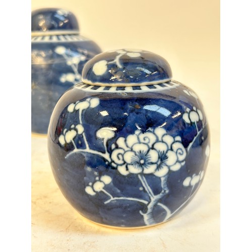 140 - 2 Chinese blue and white prunus pattern ginger jars and covers, and another, largest 15cm (3)