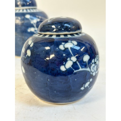 140 - 2 Chinese blue and white prunus pattern ginger jars and covers, and another, largest 15cm (3)