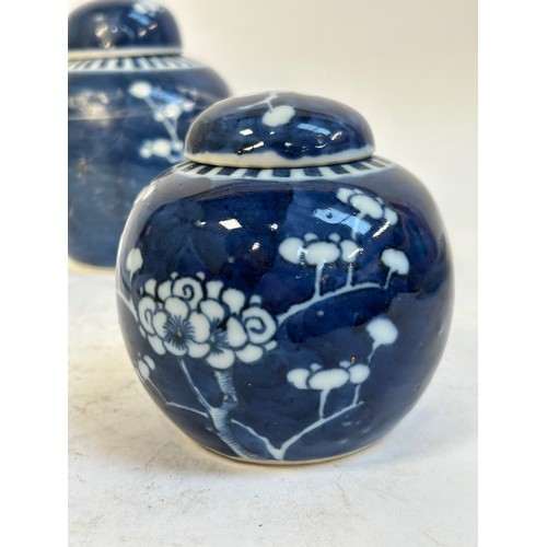 140 - 2 Chinese blue and white prunus pattern ginger jars and covers, and another, largest 15cm (3)