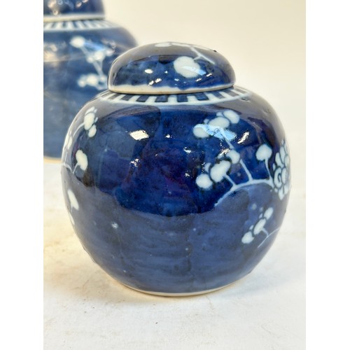 140 - 2 Chinese blue and white prunus pattern ginger jars and covers, and another, largest 15cm (3)