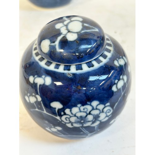 140 - 2 Chinese blue and white prunus pattern ginger jars and covers, and another, largest 15cm (3)