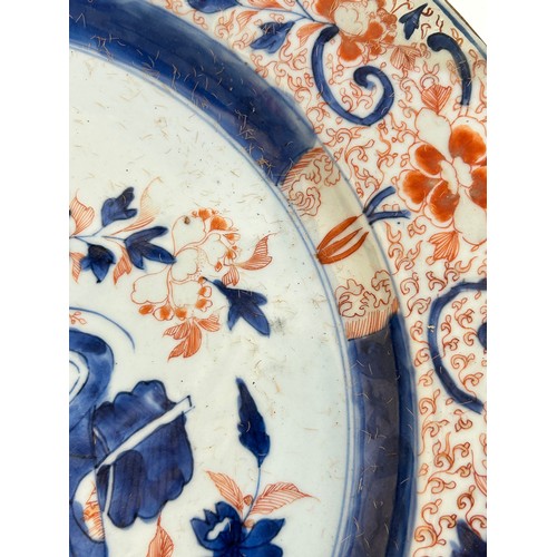 145 - A Chinese red blue and gilt decorated porcelain plate, diameter 39cm, and a Japanese blue ground pla... 