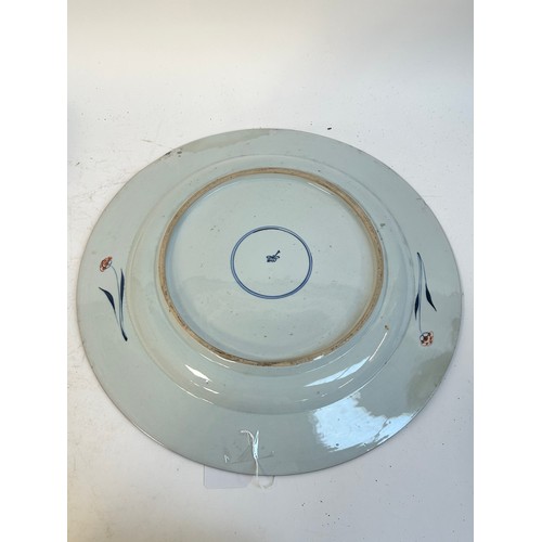 145 - A Chinese red blue and gilt decorated porcelain plate, diameter 39cm, and a Japanese blue ground pla... 