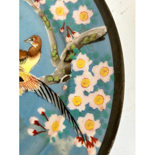 145 - A Chinese red blue and gilt decorated porcelain plate, diameter 39cm, and a Japanese blue ground pla... 