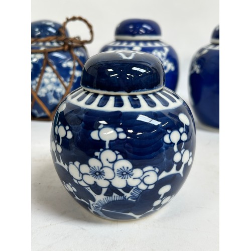 128 - 7 Chinese blue and white porcelain prunus pattern ginger jars and covers, largest 15cm