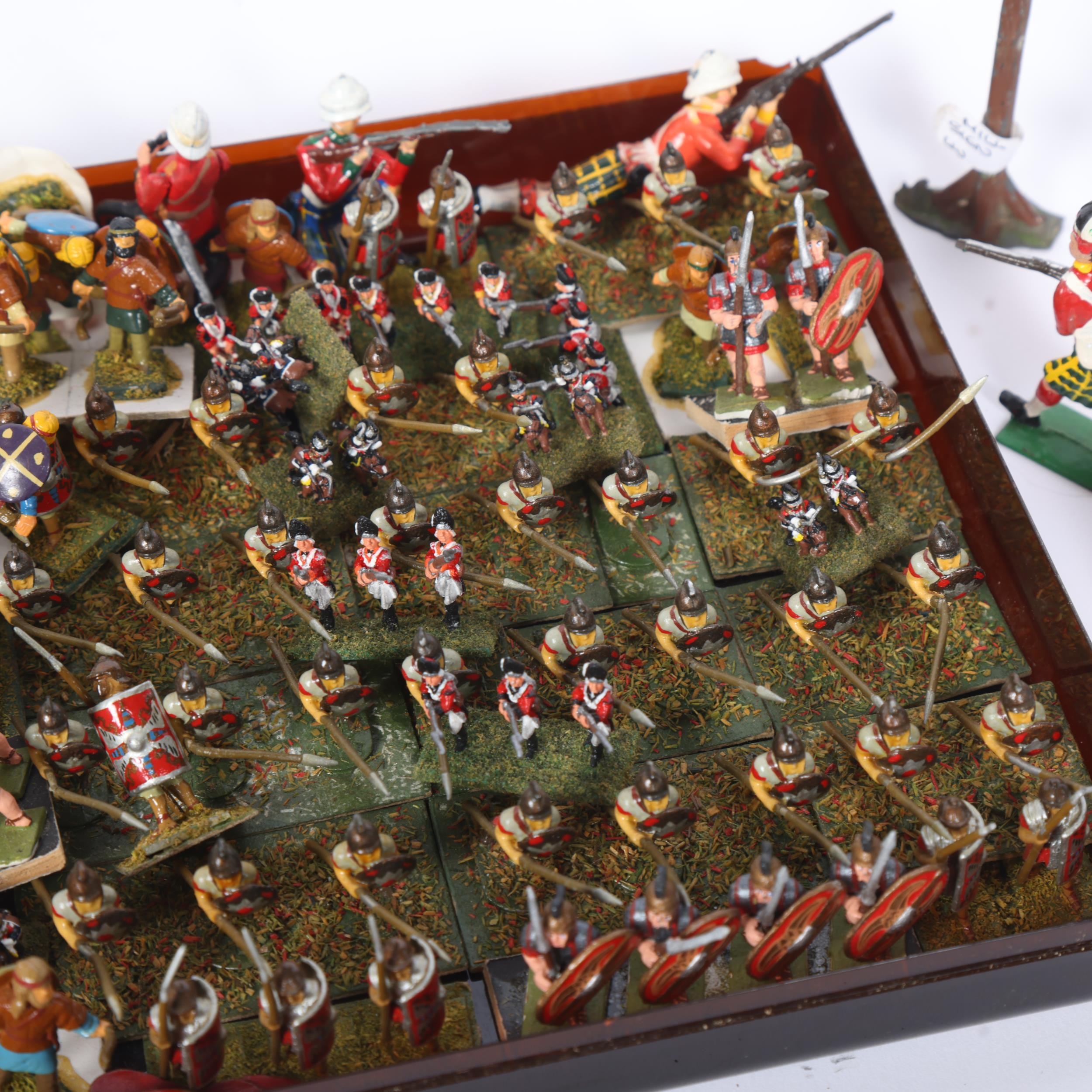 A collection of painted metal miniature figurines, examples of Roman ...