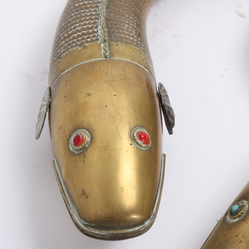 A pair of Indian brass Medina fish, articulated form, with gem set eyes ...