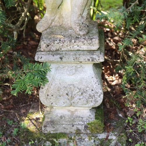 1001 - A pair of weathered concrete figures of children, on pedestal bases, overall height 113cm