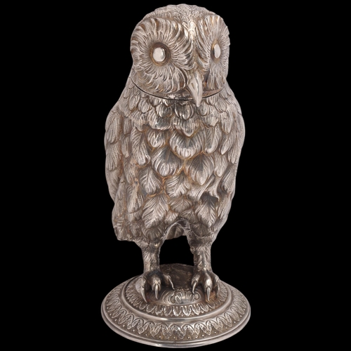 A large fine German 800 silver owl drinking cup, flowerhead maker's mark, realistically formed as a standing owl, on acanthus leaf base, with removeable head, 31cm, 51.8oz