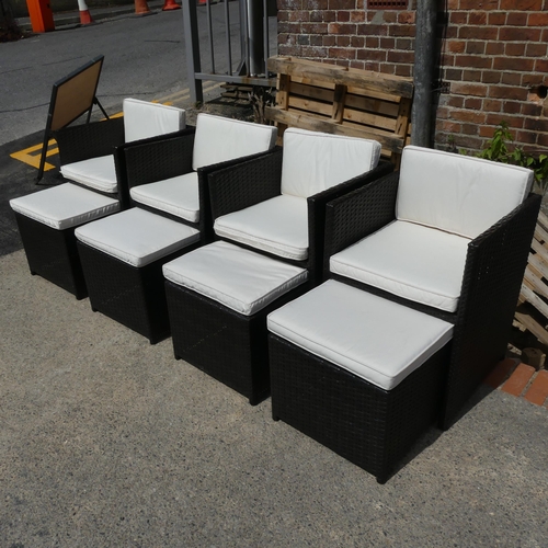A set of four modern rattan cube garden chairs, with integrated ...