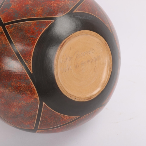 20 - Victor Barrios, Nicaragua, a hand made earthenware vase with sgraffito decoration, signed to base, h... 