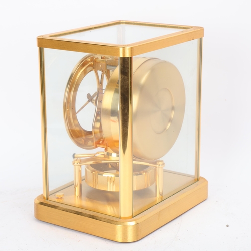 306 - Jaeger LeCoultre Atmos clock, in glazed brushed brass case, with instructions and in working order, ... 