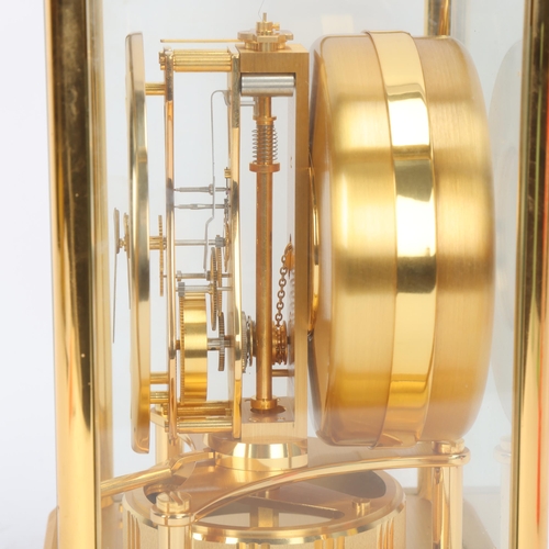 306 - Jaeger LeCoultre Atmos clock, in glazed brushed brass case, with instructions and in working order, ... 