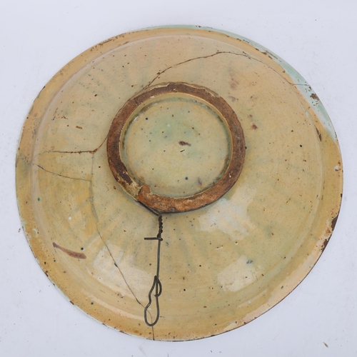 311 - An 18th century English Delft charger, depicting Adam and Eve and the Tree of Knowledge with the ser... 