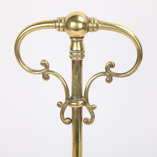 314 - A Victorian brass half bell doorstop, with ornate scrolled carrying handle, height 44cm