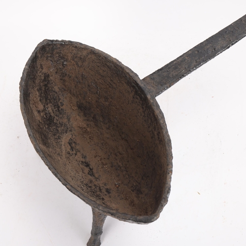 316 - A 17th or 18th century cast-iron grisset pan, possibly Irish or Sussex, the bowl of pointed oval for... 